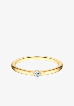 Dünner Goldbandring mit einem kleinen runden Diamanten in der Mitte auf weißem Hintergrund.