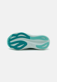 Shoe sole with a white base and teal accents; features a textured pattern for grip and comfort; rounded edges and flexible design.