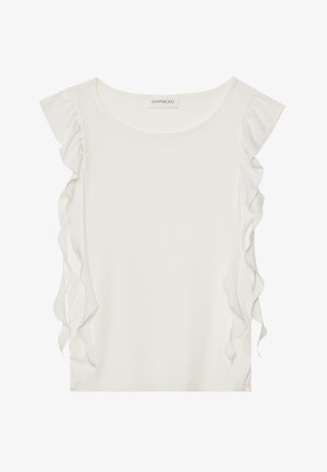 Haut blanc à manches courtes en tissu doux, avec des détails à volants le long des coutures latérales et un col rond.