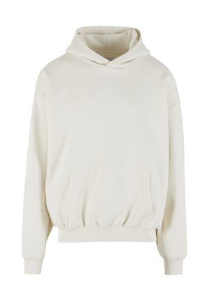 Mikina s kapucňou krémovej farby vyrobená z mäkkej látky. Má predné vrecko, elastické manžety a kapucňu so sťahovacou šnúrkou s malým vyšívaným logom.