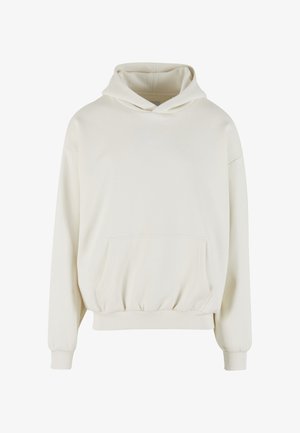 Mikina s kapucňou krémovej farby vyrobená z mäkkej látky. Má predné vrecko, elastické manžety a kapucňu so sťahovacou šnúrkou s malým vyšívaným logom.