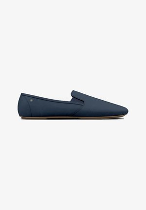 Navy slip-on shoes with a smooth fabric upper, pointed toe design, and a tan rubber sole. Features minimal stitching and a small logo detail.
