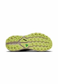 Trail running shoe sole, featuring a textured green rubber outsole with multi-directional lugs for traction, and a cushioned beige midsole.