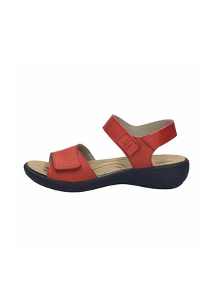 Red open-toe sandal with adjustable straps and cushioned beige insole on a black wedge sole.