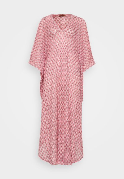 Red and white patterned kaftan featuring a V-neckline, wide sleeves, and a loose fit, made from lightweight fabric with a textured finish.
