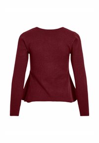 Punane soonikkoes pikkade varrukatega pluus ümmarguse kaelusega ja ääres küljsõlgudega. Materjalil on pehme tekstuur ja istuv siluett.