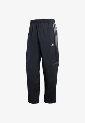 Czarne spodnie sportowe z elastycznym paskiem w talii, z szarymi paskami po bokach, teksturowanym panelem i zwężanym krojem nogawki.