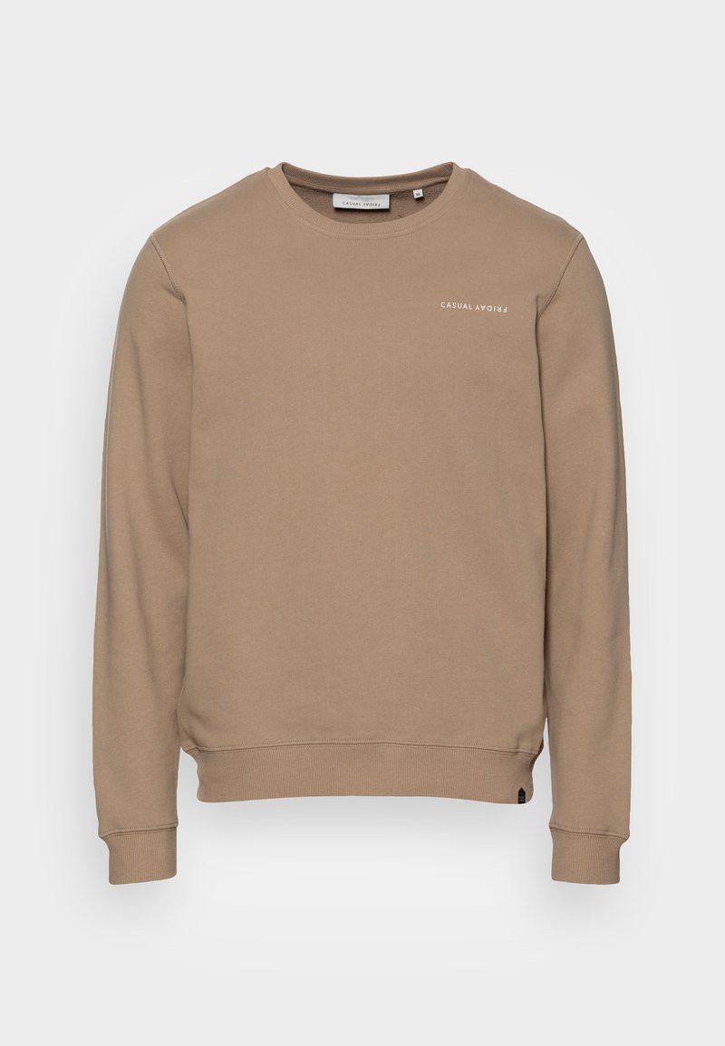 Beige genser laget av myk bomullsblanding, med rund hals og ribbestrikkede mansjetter. "CASUAL" logo i hvitt på venstre front.