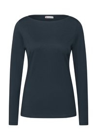 Långärmad skjorta i mörk marinblå. Tillverkad av mjukt och stretchigt material. Har en bred rund halsringning och en figurnära siluett. Inga märkbara mönster eller detaljer.