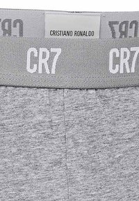 Grau Baumwollunterwäsche mit einem hellgrauen elastischen Bund, der das weiße "CR7"-Logo trägt. Die strukturierte Stoffbeschaffenheit verleiht ein weiches Aussehen.