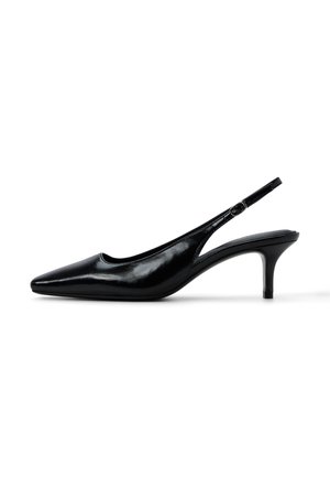 Black patent leather slingback pump with pointed toe and low kitten heel, featuring a small adjustable buckle strap.