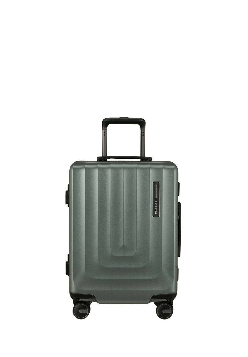 Hartschalentrolley in mattem dunkelgrün mit gerippter Optik. Mit einem Teleskopgriff und vier multidirektionalen Rollen ausgestattet.