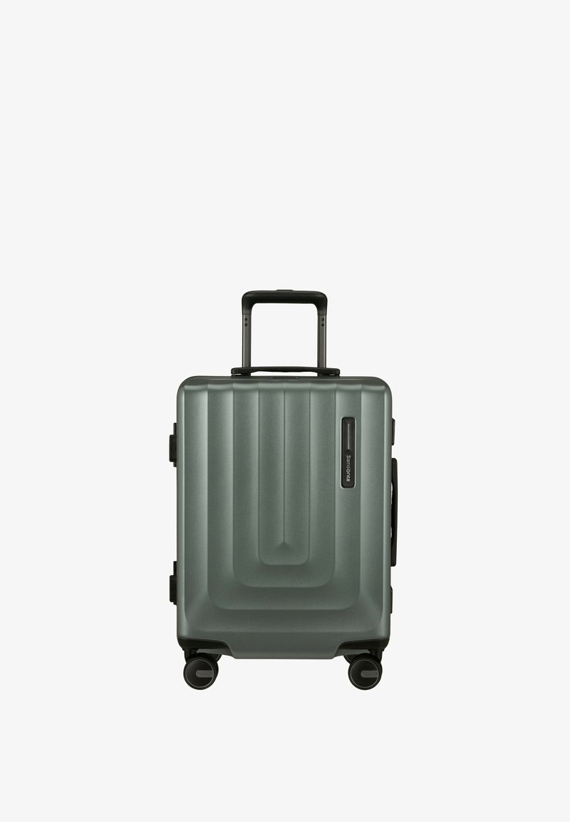 Hartschalentrolley in mattem dunkelgrün mit gerippter Optik. Mit einem Teleskopgriff und vier multidirektionalen Rollen ausgestattet.