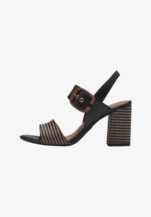 Black and tan block-heeled sandal featuring a woven design on the strap with a wide buckle accent. Smooth leather upper and textured heel.