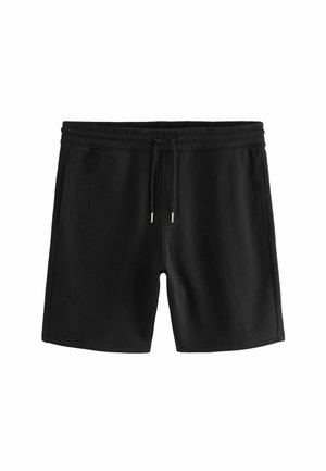 Mustat naru-housut elastisella vyötäröillä ja sivutaskuilla, suunniteltu rentoon tai urheiluvaatteeksi.