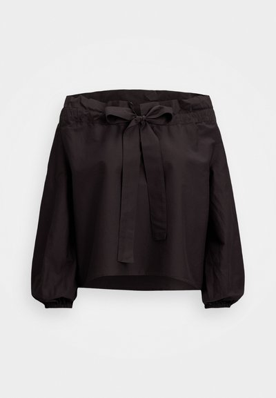 Black cropped top with a cinched waist, featuring a front tie and elasticized cuffs. Made of lightweight fabric with a smooth texture.