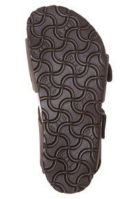 Semelle de sandale en caoutchouc noir avec un motif circulaire élaboré. Présente une forme contournée et une texture antidérapante pour une meilleure traction.