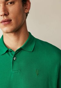 Next REGULAR - Poloshirts - green tennis