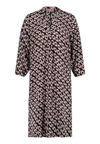 Paino mekko mustalla pohjalla, jossa on geometrinen kuvio valkoisissa, punaisissa ja harmaissa sävyissä. Siinä on lovettu kaulus ja kolmennesosa hihat.