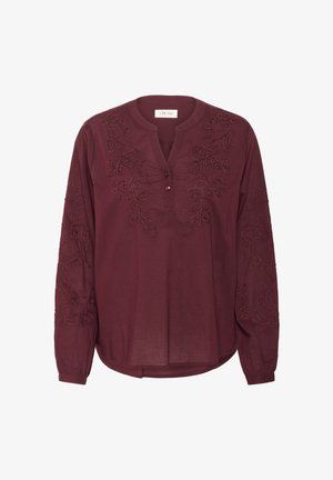 Burgundy long-sleeve blouse, featuring embroidered floral patterns, a v-shaped neckline with a single button, and a relaxed fit.