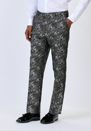 Black and gray patterned trousers with a floral texture, tailored fit, side pockets, and a smooth finish. Paired with glossy black shoes.