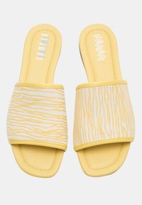 Yellow slide sandals featuring a textured white upper with yellow wavy stripes, soft footbed, and a smooth sole for comfort.