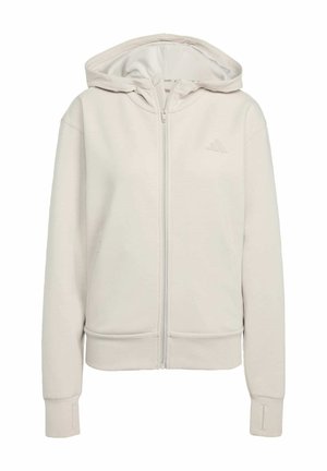 Felpa con zip di un grigio chiaro realizzata in tessuto morbido. Presenta un cappuccio a doppio strato, polsini a coste e un logo discreto sul lato sinistro del petto.