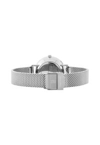 Silver stainless steel watch with a mesh strap, round case, minimalistic design, and a clasp featuring engraved logo detail.