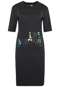 Svart kortärmad klänning med en rektangulär holografisk grafisk design med texten "LOVE MOSCHINO" på framsidan, tillverkad av mjukt bomullsmaterial.