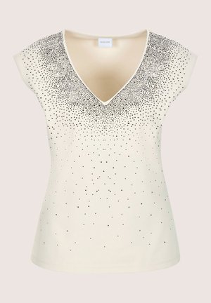 Roomkleurige top met korte mouwen en een diepe V-hals, versierd met zilveren en zwarte strass-steentjes in een verloopmotief over de borst.