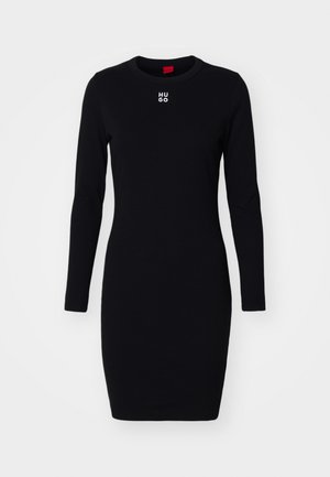 Black long-sleeve dress made of soft, stretchy fabric. Features a round neckline and "HUGO" logo in white on the chest. Form-fitting design.