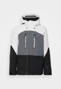 Veste imperméable pour homme présentant un design color-block en blanc, gris et noir. Comprend plusieurs poches zippées et une capuche ajustable.