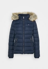 Námornícky modrá prešívaná bunda s odnímateľnou kapucou s umelou kožušinou. Má zipsové bočné vrecká a horizontálny prešívaný dizajn pre zateplenie.