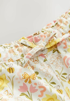 Stoff mit Blumenmuster in Pastellfarben, der gelbe Bienen, rosa Schmetterlinge und grüne Blätter zeigt. Elastischer Bund mit einer Schleifendetaillierung.