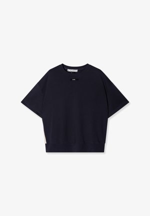Navy cotton T-shirt with short sleeves, relaxed fit, ribbed crew neckline, and a contrasting beige panel at the hem. Minimalist branding.