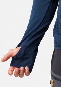 Langarmshirt van marineblauwe stof met duimsgaten bij de mouwen. Soepele textuur, sportieve pasvorm en contrasterende binnenstof bij de mouwen.