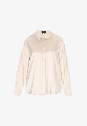 Jasnobeżowa satynowa bluzka z długim rękawem, z zaostrzonym kołnierzykiem, zapięciem na guziki z przodu oraz luźnym krojem. Gładka faktura o minimalnym połysku.