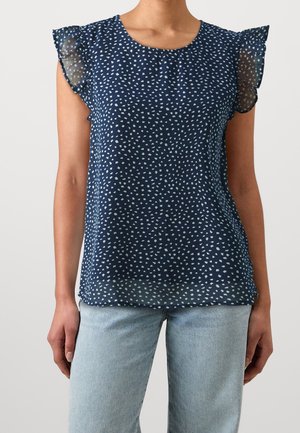 Haut sans manches bleu marine avec des motifs en forme de cœurs blancs éparpillés, manches à volants transparentes et encolure arrondie, fabriqué en tissu léger.