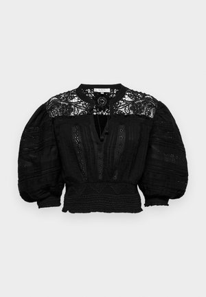 Blusa nera con dettagli in pizzo intricati, maniche a sbuffo voluminose, tessuto testurizzato e vita aderente con cuciture decorative.