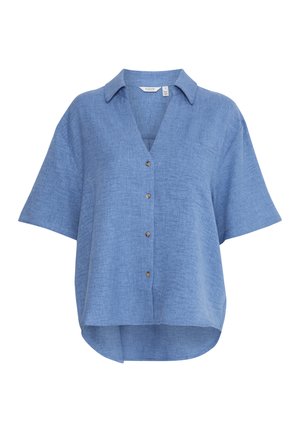 Chemise à manches courtes en lin bleu clair, avec un col en V, un ourlet arrondi et une poche poitrine unique.