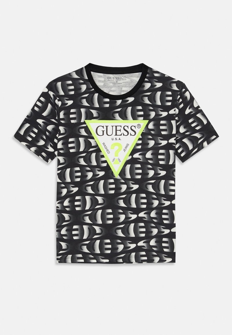 T-shirt à manches courtes en noir et blanc avec un triangle vert néon et le logo "GUESS U.S.A." centré sur le devant.