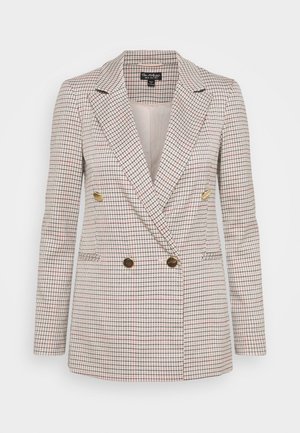 Blazer beige à double boutonnage avec un motif à carreaux noir et rouge et quatre boutons dorés, présentant un col cranté et des manches longues.