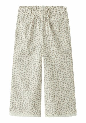 Kreemikas värvusega laia säärega püksid, millel on väikesed pruunid lillemustrid, elastne vöökoht ja hammastega pitsiääris sääre all.