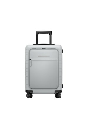 Silver hard-shell suitcase with retractable black handle, smooth texture, front zippered pocket, and four wheels for mobility.
