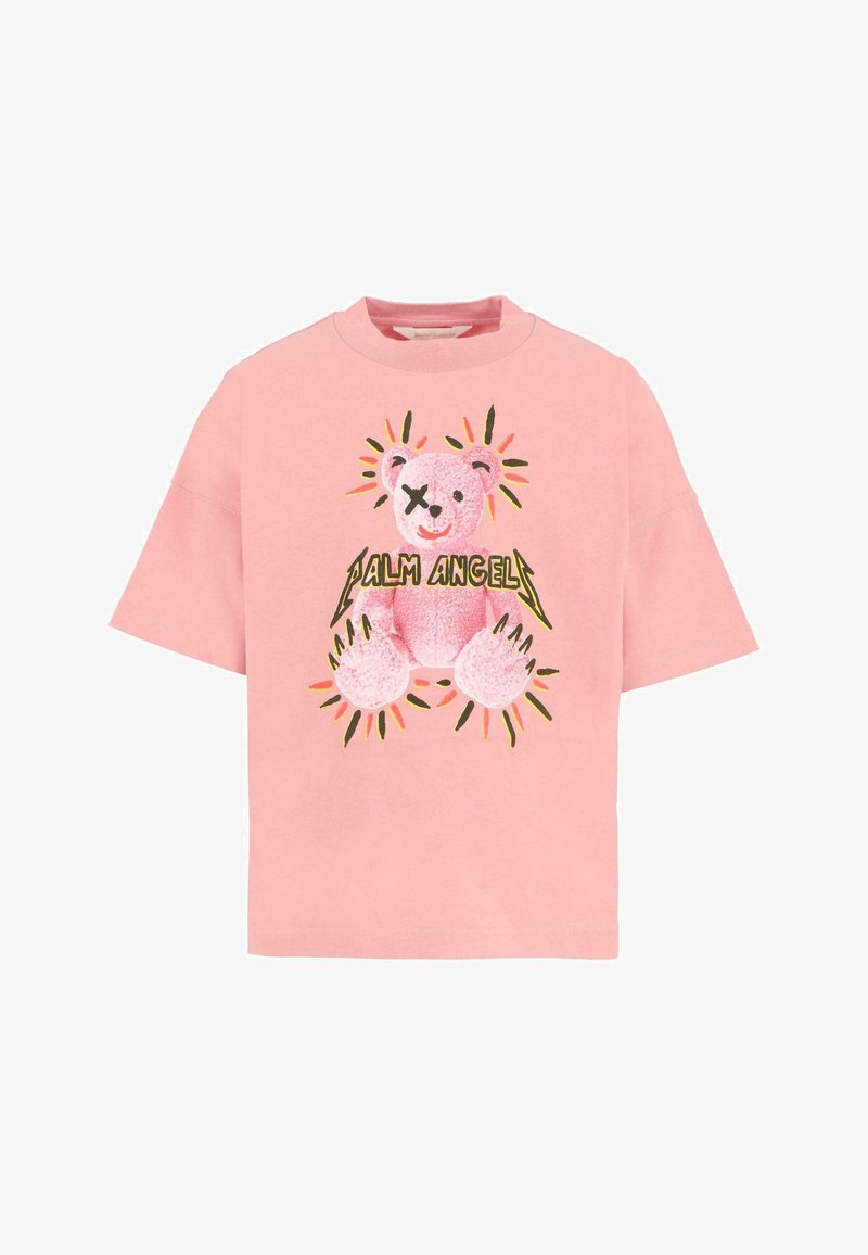 Roze katoenen T-shirt met korte mouwen, met een berenafbeelding in lichtroze met zwarte accenten en gele zonnestraaldetails. De tekst zegt "Palm Angels."