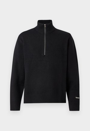 Svart stickad tröja med hög krage och kort dragkedja. Har ribbade ärmslut och midja som ger en strukturerad look och avslappnad passform.
