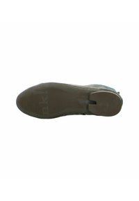 Shoe sole with a textured, ridged surface; predominantly gray with blue accents. Features a thick, sturdy design for traction.