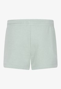 Lysegrønne bomullsshorts med en glatt tekstur, som har en elastisk midje og et enkelt, udekorerte design. Bakvisning vist.