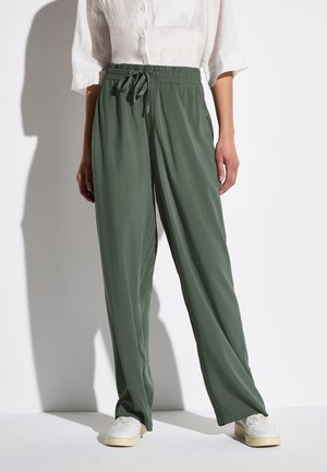Groene, lichte broeken met een losse pasvorm en elastische taille met een trekkoord. Glad textuur met zijzakken en wijde pijpen.