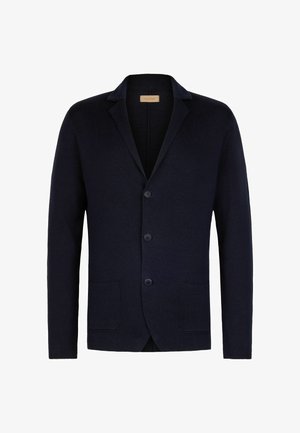 Blazer en maille bleu marine foncé avec col cranté, trois boutons sur le devant et deux poches plaquées à l'avant, présenté sur fond blanc.